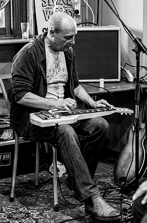 Me playing this lap steel in July 2019