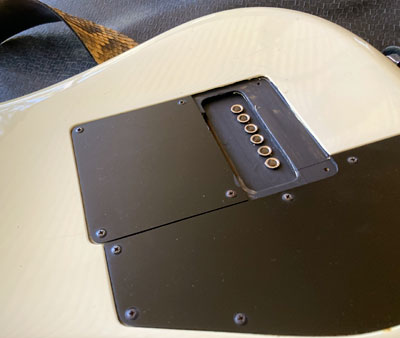 Hardtail bridge string through