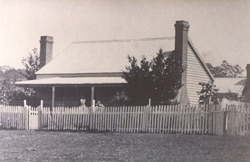 Mary on the verandah of her house